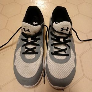 Gray and white under armour sneakers